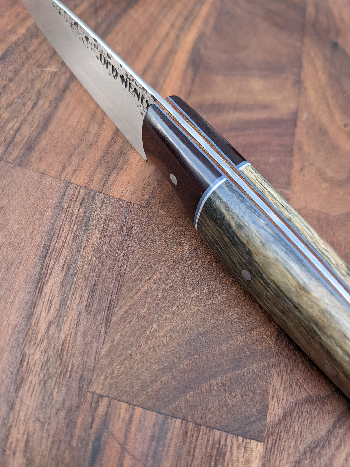 Spine of a paring knife with liners.