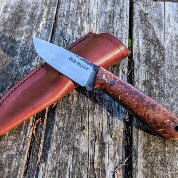 A Heeler knife model with a maple burl handle.